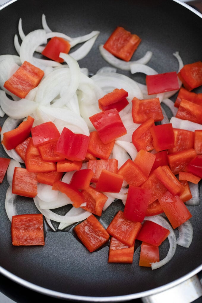 Sauteing onions and bell peppers.