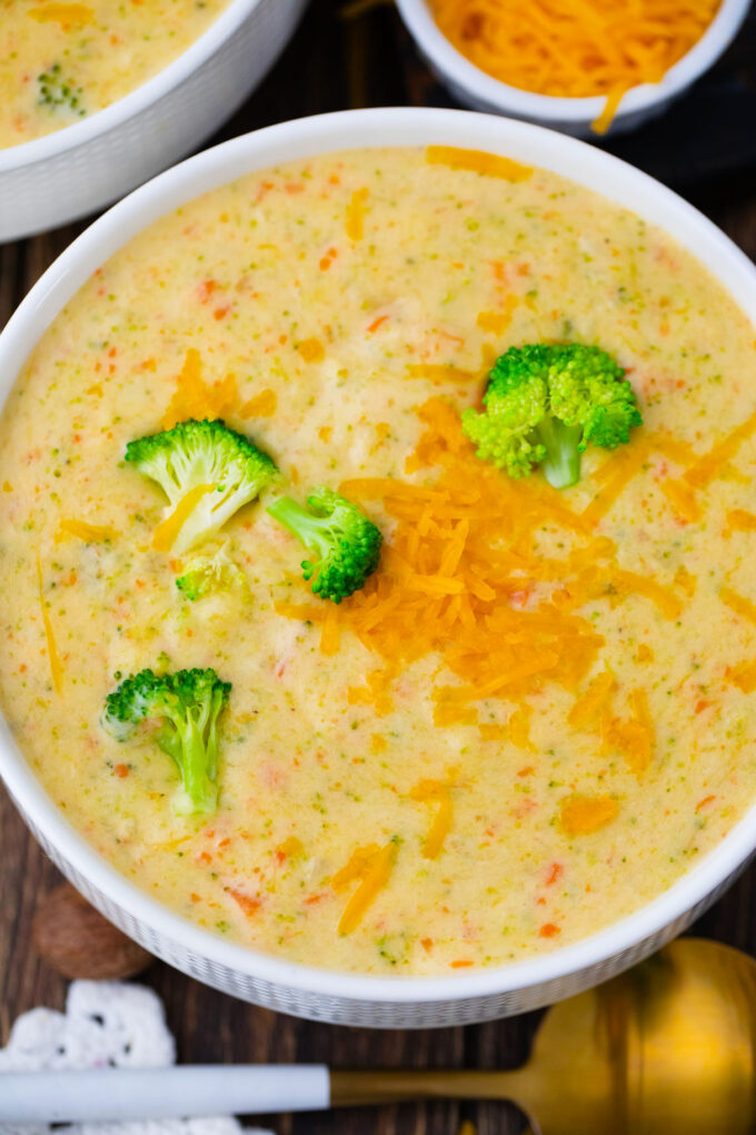 Panera Bread broccoli cheddar soup topped with cheddar cheese.