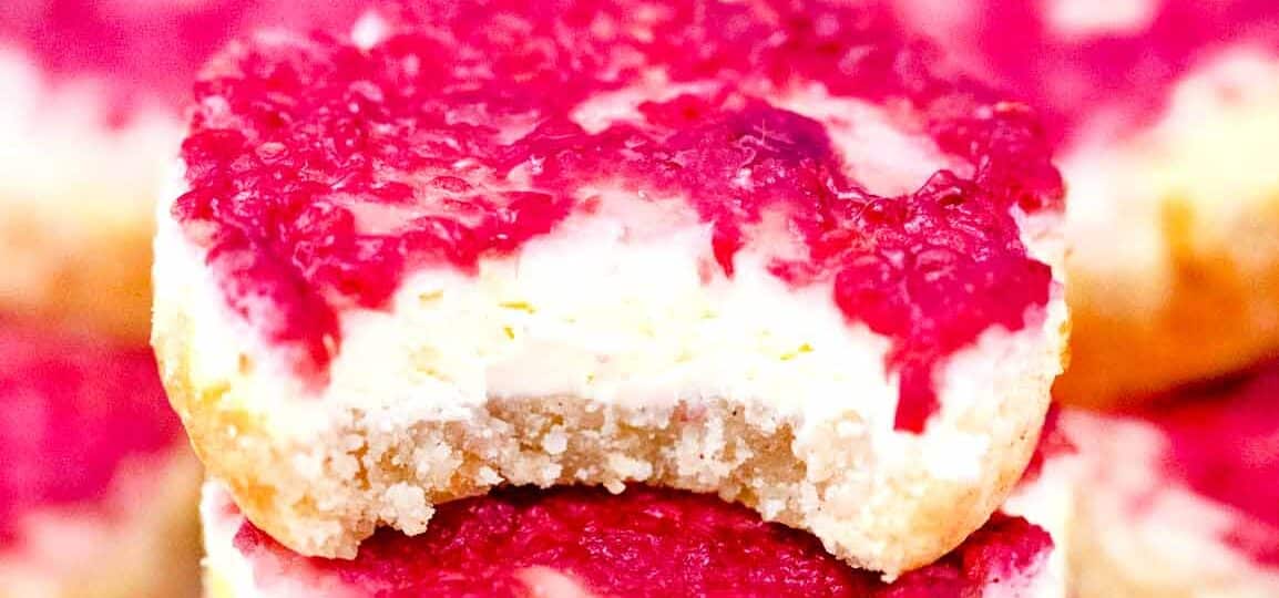 a biten keto raspberry cheesecake bite on top of others