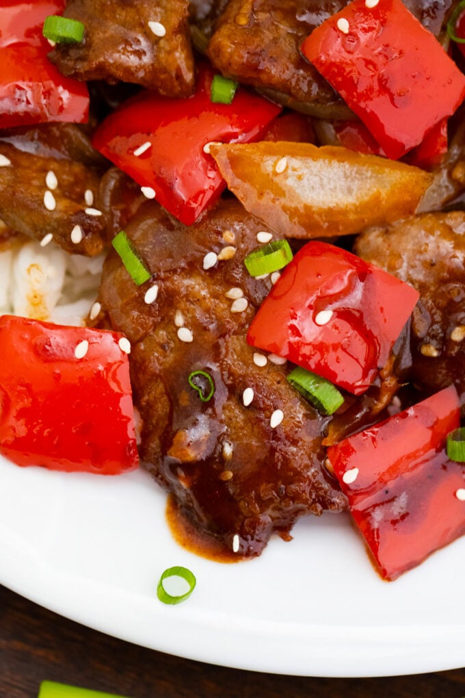 Juicy Panda Express Beijing beef with red bell pepper and onions.