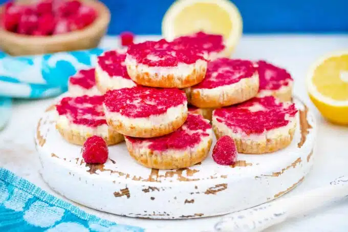 keto raspberry cheesecake bites on a serving board