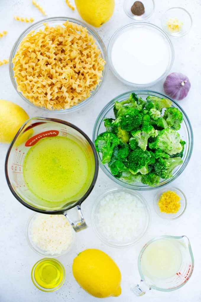 overhead shot of lemon broccoli pasta ingredients in bowls on a table