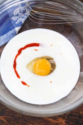 buttermilk egg and hot sauce in a bowl
