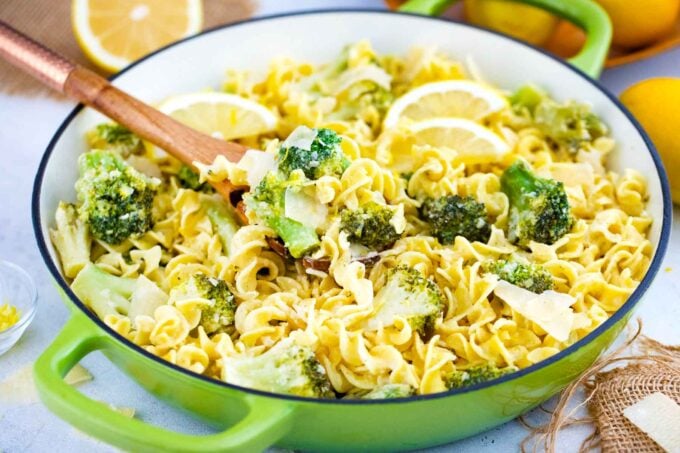 a overhead shot of lemon broccoli pasta skillet with a serving spoon in it