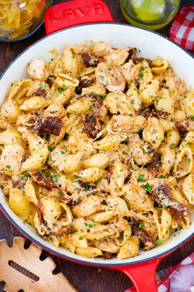overhead shot of chicken mozzarella pasta in a skillet