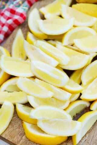 sliced lemon wedges on a cutting board