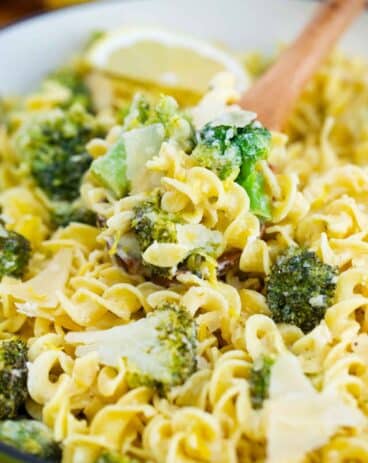 close shot of lemon broccoli pasta with a serving spoon in it