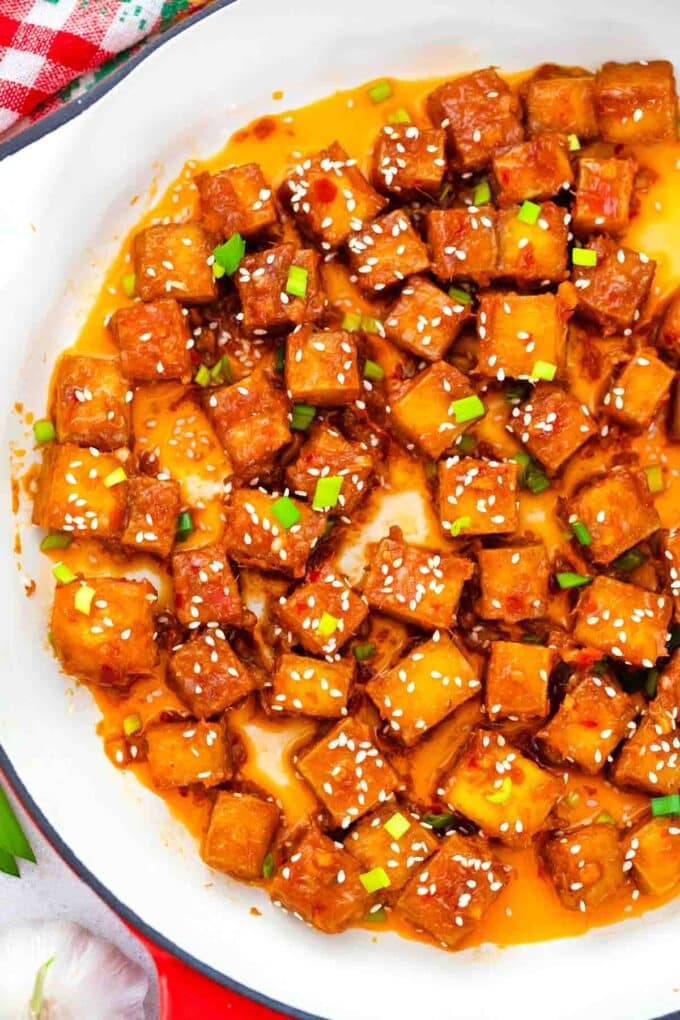 overhead shot of crispy spicy Korean tofu in a skillet