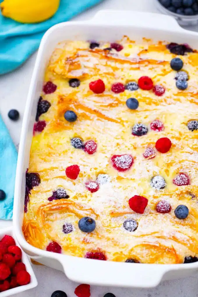 phyllo crinkle cake or phyllo dough cake in a baking pan with powdered sugar and berries