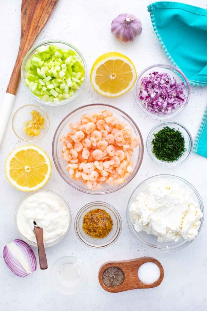 shrimp salad sliders ingredients in bowls on a table