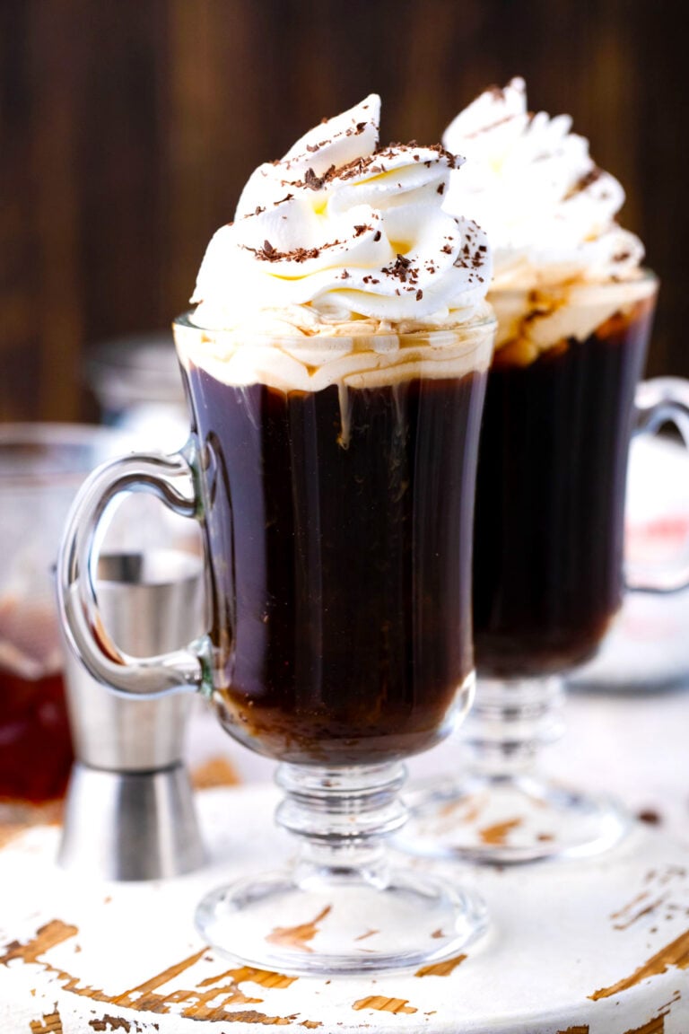 Two cups of Irish coffee with whiskey.
