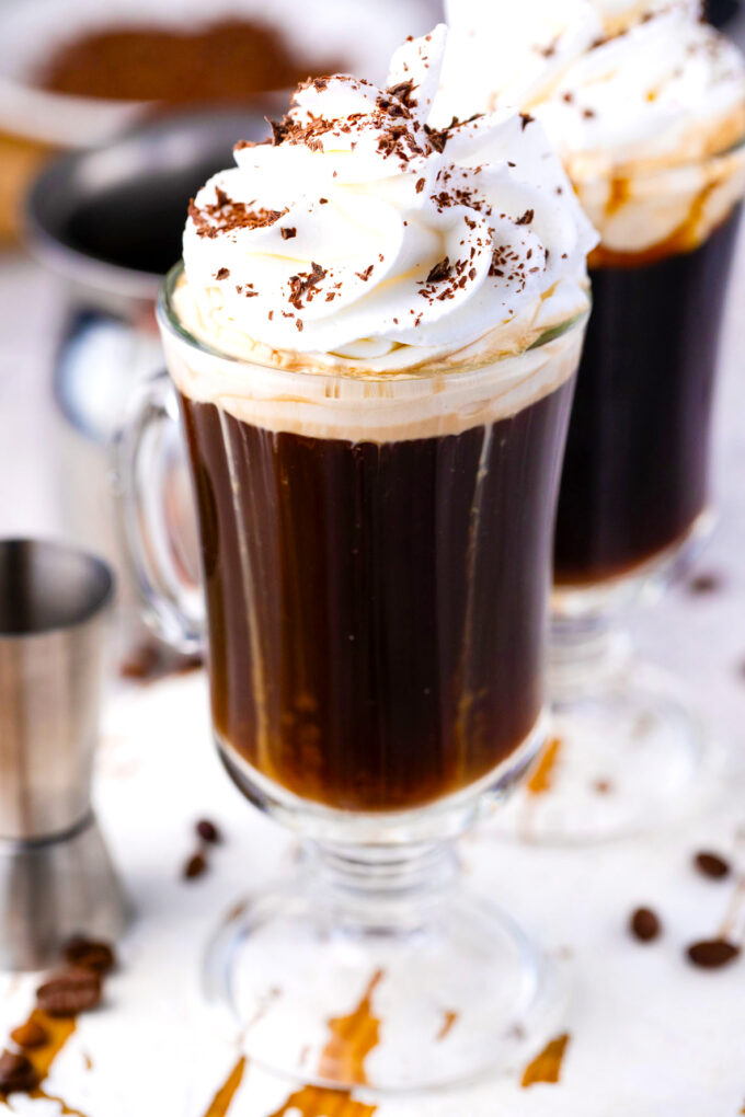 Homemade Irish coffee with whiskey and whipped cream.