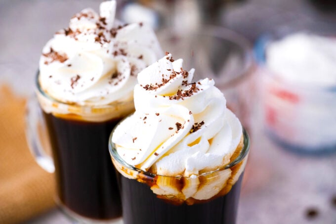 Homemade Irish coffee topped with whipped cream and chocolate shavings.