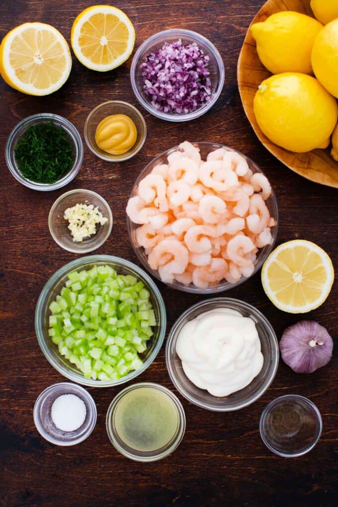 overhead shot of shrimp salad ingredients in bowls on a table