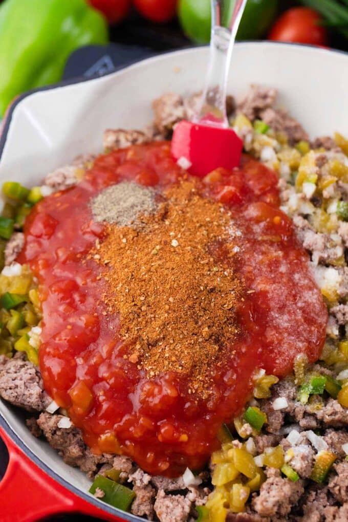 Taco beef mixture for taco lasagna in a skillet.