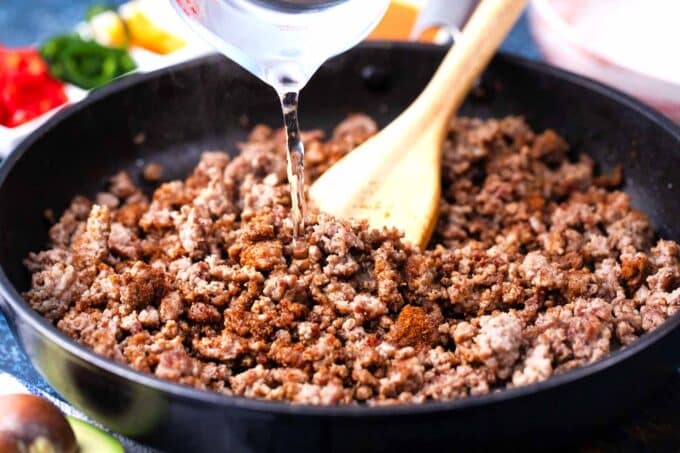 Cooking ground beef in a skillet.