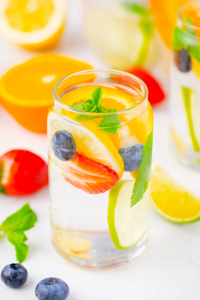 A glass of citrus berry detox water.