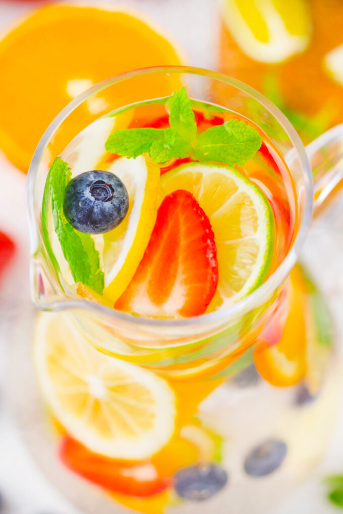 Overhead shot of a pitcher with berry citrus detox water.