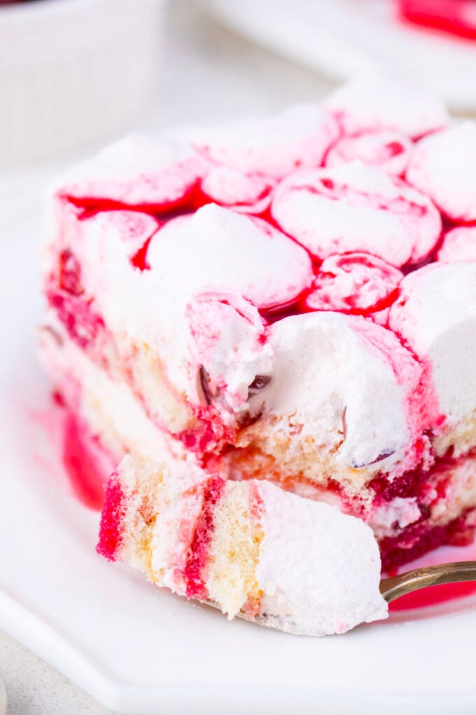 Close shot of a slice of creamy cherry amaretto tiramisu.