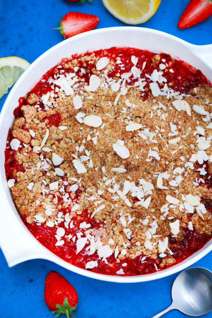 Homemade strawberry crisp topped with slivered almonds.