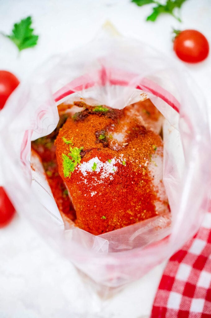 Marinating chicken for grilled chicken Southwest salad.