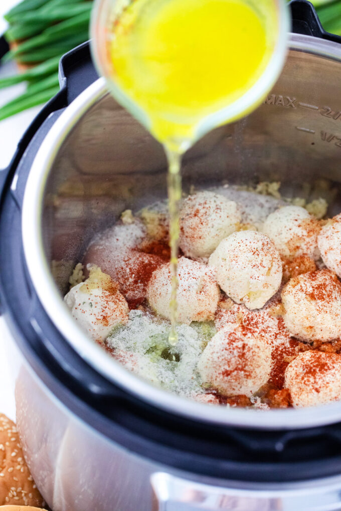 Combining Instant Pot crack chicken ingredients in the pot.