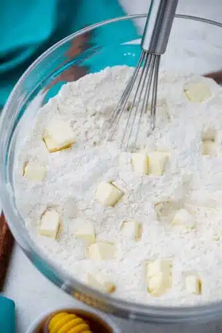 flour with cubes of shortening in a bowl