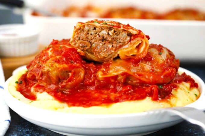 Polish stuffed cabbage rolls on top of mashed potatoes