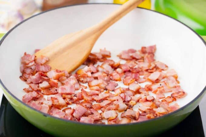 Cooking bacon in a skillet.
