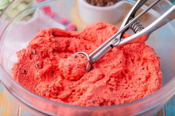 Watermelon truffles pink batter in a bowl.