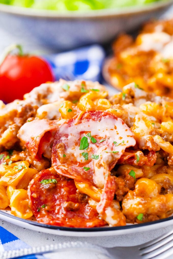 A plate of instant pot pizza pasta with pepperoni.