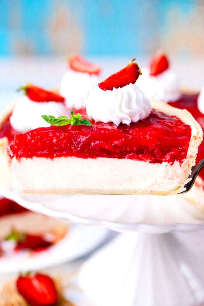 A slice of strawberry cheesecake pie on a serving spatula.
