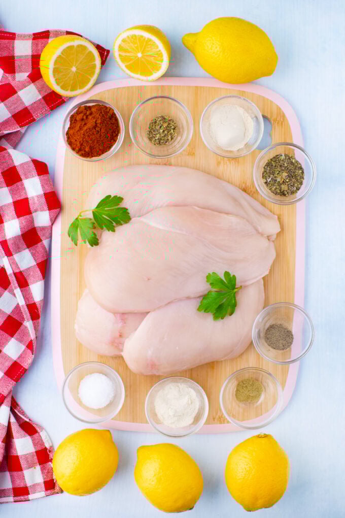 Overhead shot of blackened chicken ingredients on a cutting board.