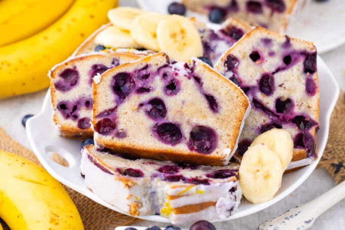 Sliced of blueberry banana bread with juicy blueberries.