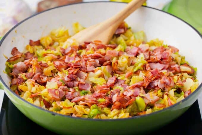 Southern bacon fried cabbage in a skillet.