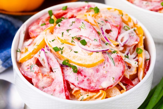 A bowl of creamy tomato salad.