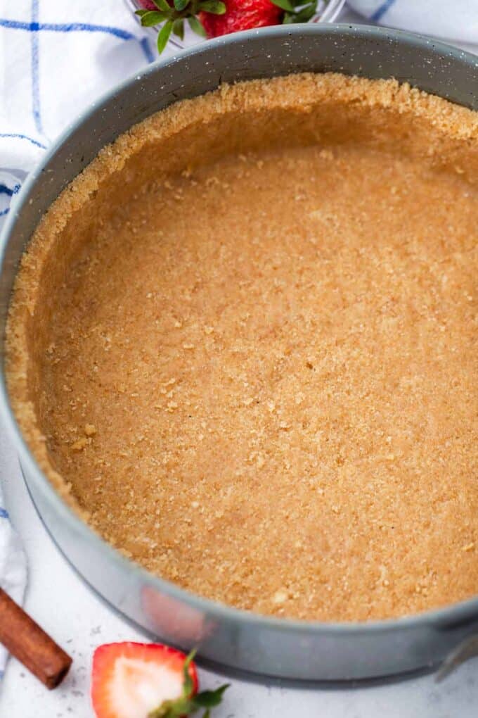 cheesecake graham cracker crust in a springform pan