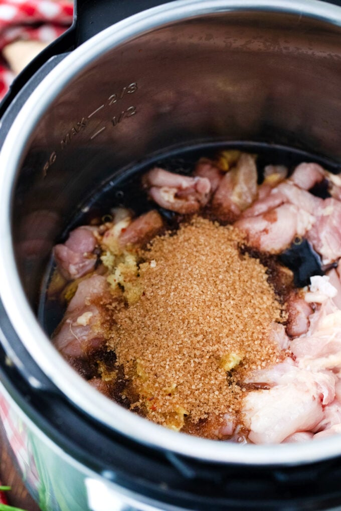 Dump and cook Instant Pot garlic sesame chicken ingredients in the pot.