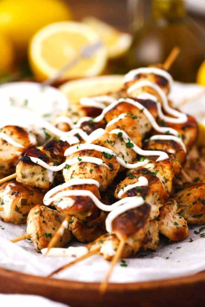 keto Italian chicken skewers drizzled with tzatziki sauce