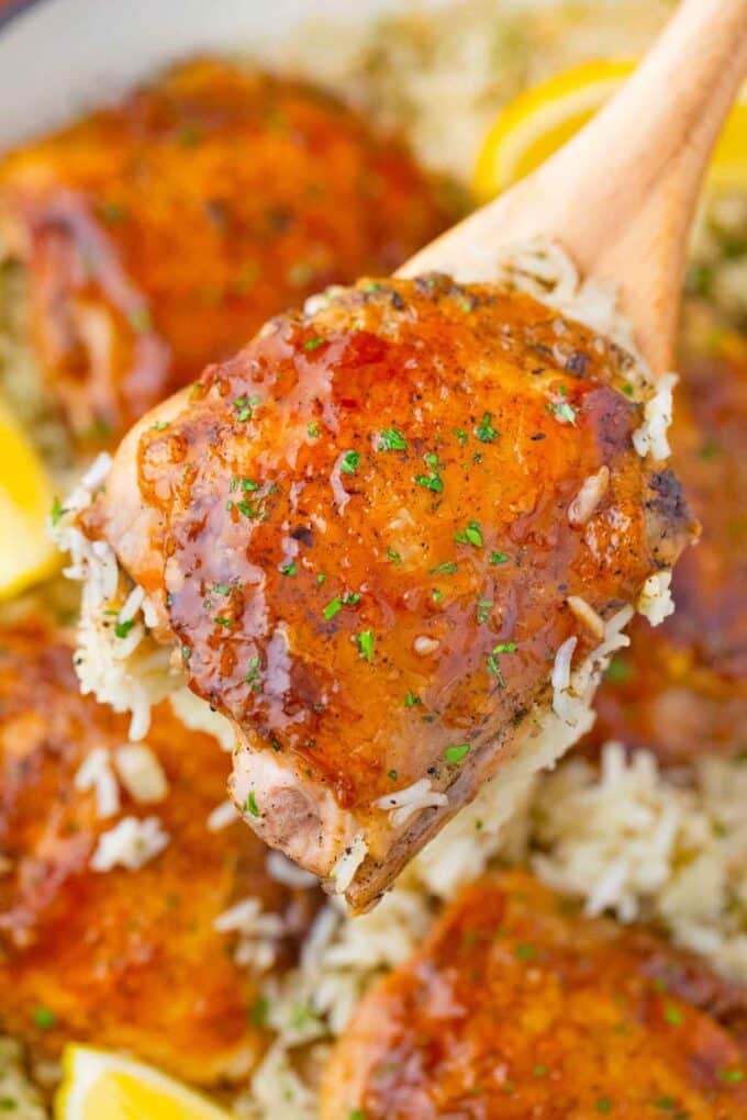 perfectly browned and glazed honey garlic chicken thigh on a serving spatula