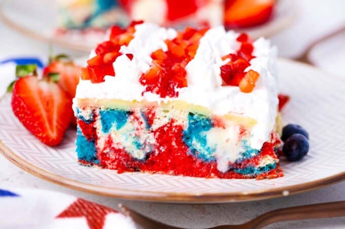 A slice of homemade red, white, and blue poke cake.