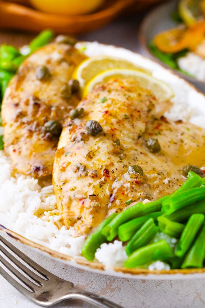 Oven roasted lemon butter tilapia over rice.