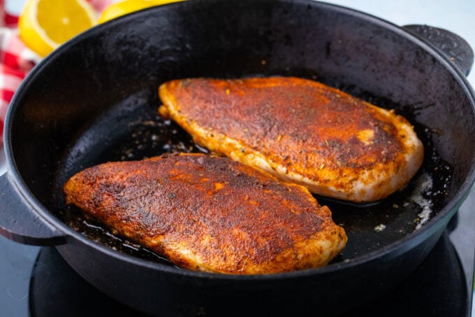 Cooking blackened chicken.
