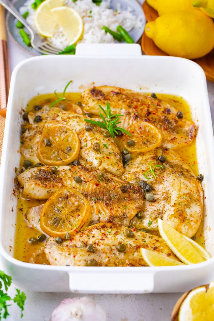 Oven roasted lemon butter tilapia fillets with garlic.