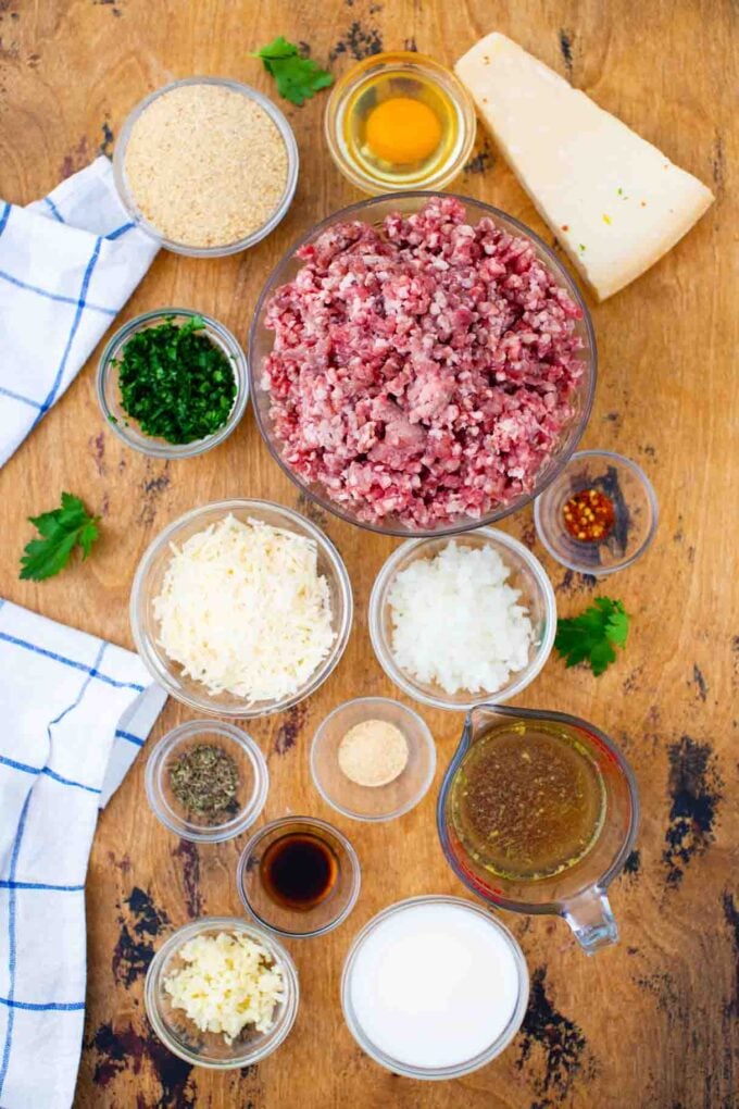 homemade meatballs ingredients in bowls on a table