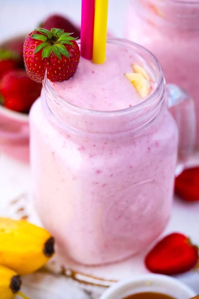 Homemade pink strawberry banana smoothie.