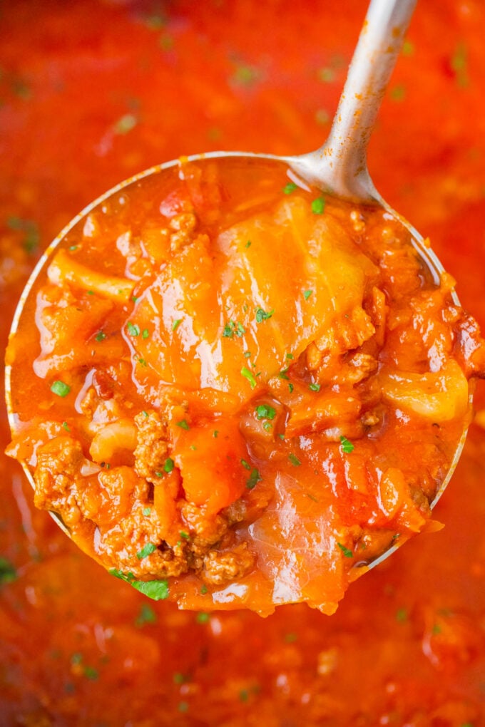 A ladle of instant pot cabbage roll soup.