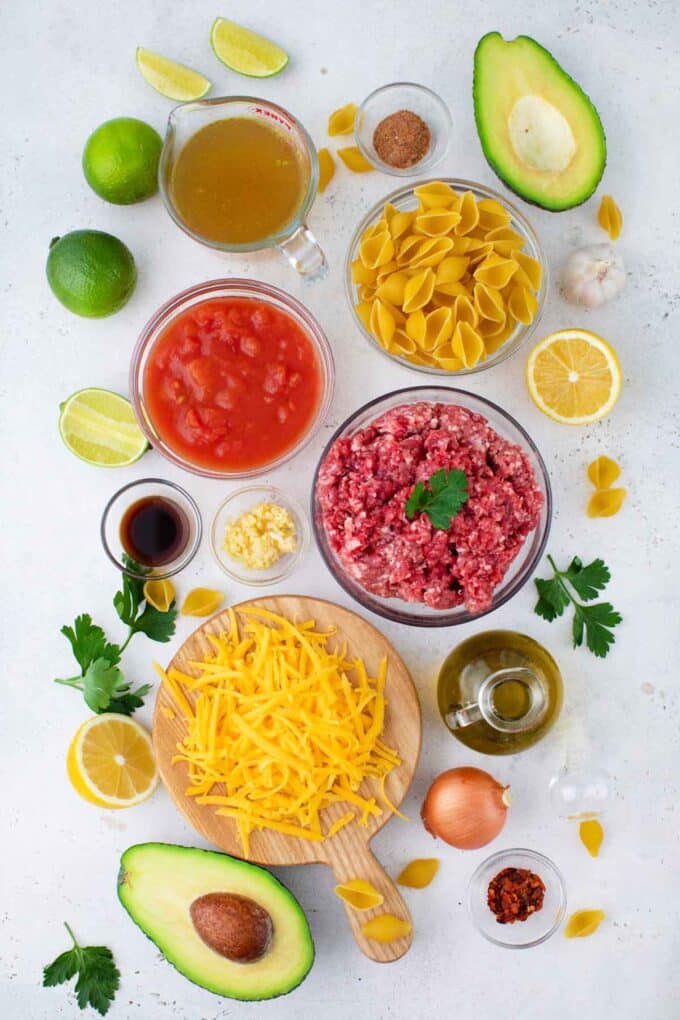 instant pot taco pasta ingredients in bowls on a table