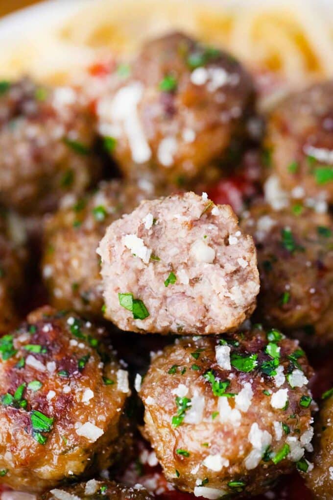 juicy homemade meatball sliced in half revealing tender interior