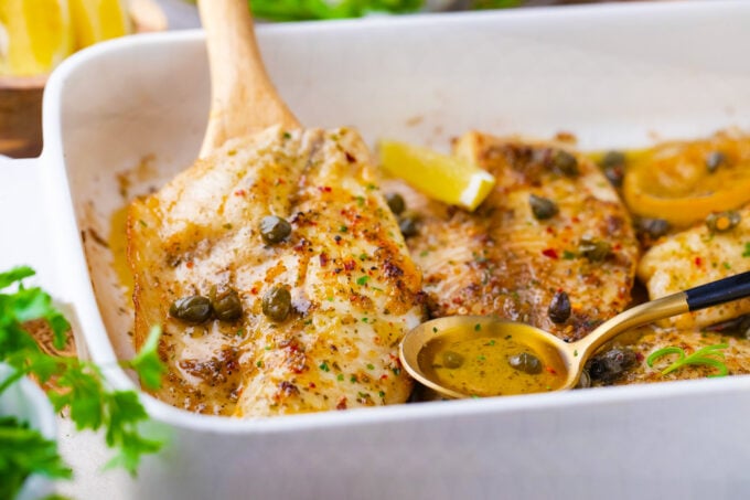 Homemade lemon butter tilapia fish fillets.